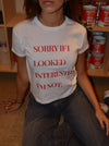 "Sorry if I looked interested, I'm not" baby tee - Hvid